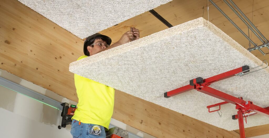 worker installing acoustical ceiling