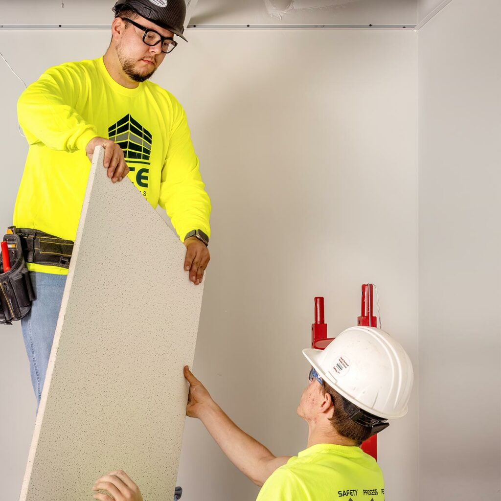 workers installing acoustical ceilings